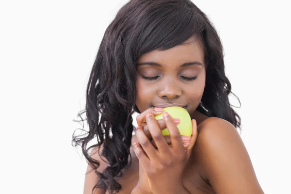 Woman holding an apple with eyes closed — Stock Photo, Image