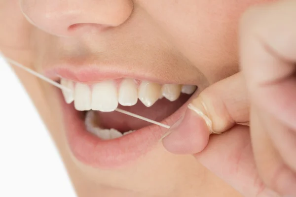 Close up of mouth and dental floss — Stock Photo, Image