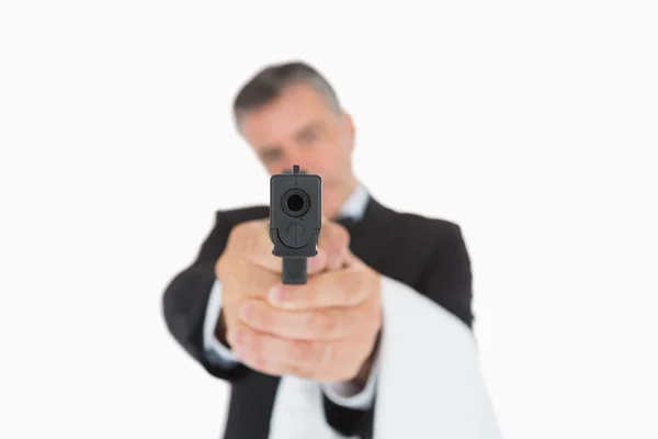 Waiter holding gun directly ahead — Stock Photo, Image