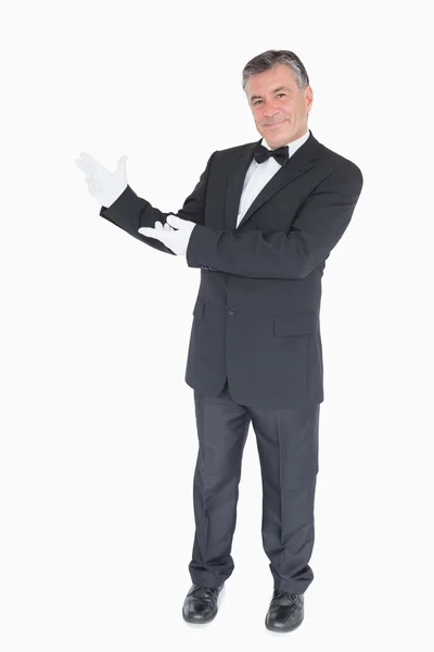 Man showing us something against white background — Stock Photo, Image