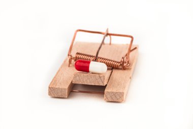 Mousetrap with a pill clipart