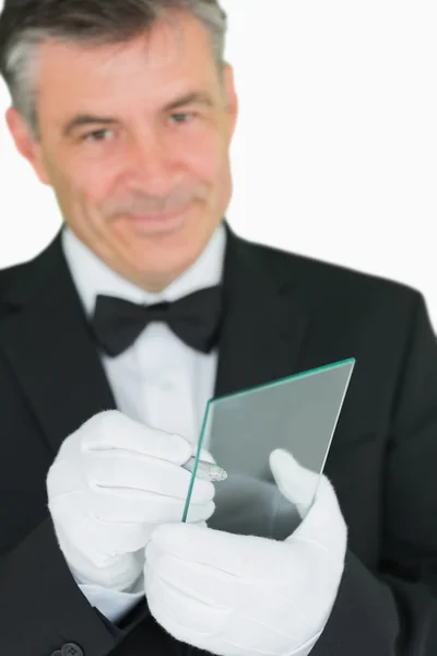 Smiling waiter using virtual screen — Stock Photo, Image