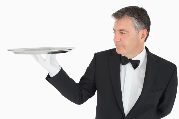 Man holding a silver tray — Stock Photo, Image