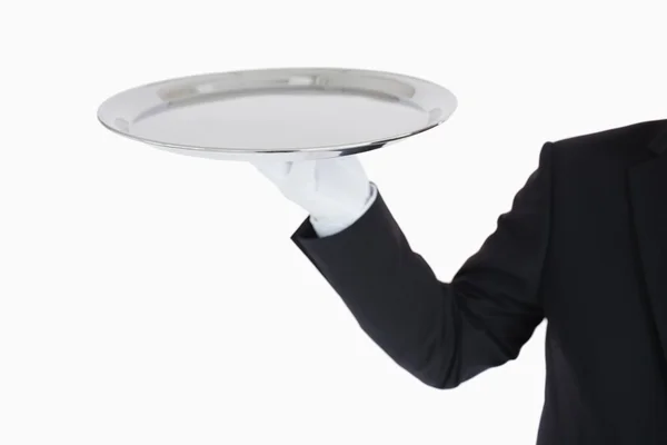 Hand with white gloves holding a silver tray — Stock Photo, Image