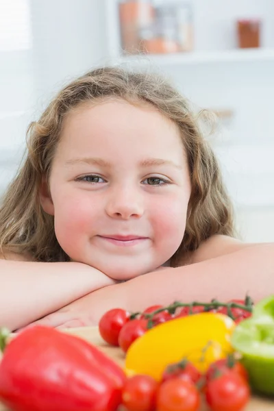 Close up of girl leaning on table — Stock Photo, Image