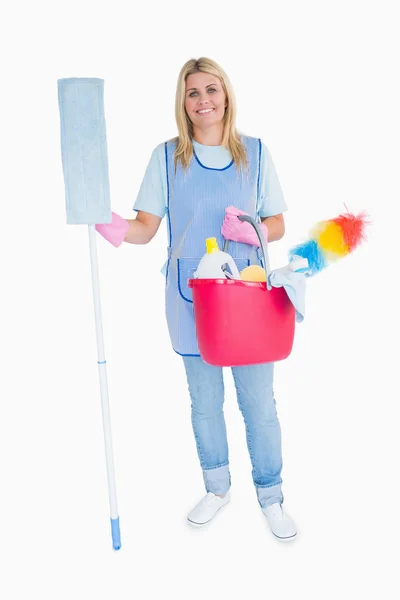 Cheerful maid holding a pink bucket and mop — Stock Photo, Image