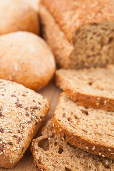 Wholemeal bread lying on the background — Stock Photo, Image
