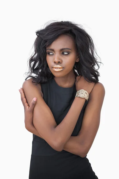 Woman standing with arms crossed — Stock Photo, Image