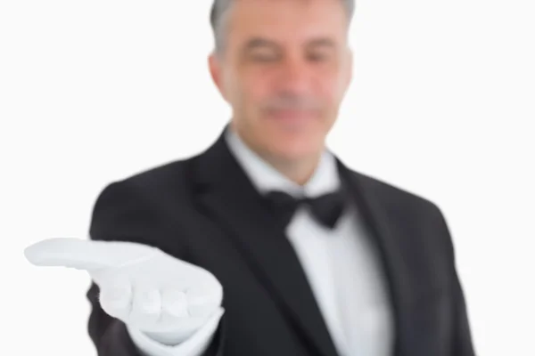 Waiter showing his opened hand — Stock Photo, Image