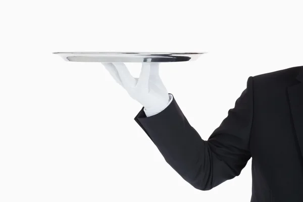 Hand with gloves holding a silver tray — Stock Photo, Image
