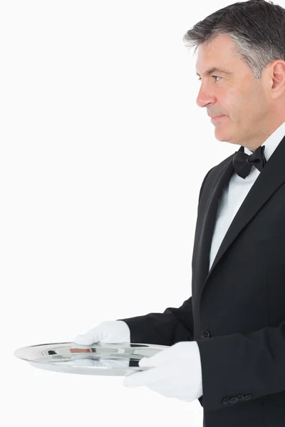 Waiter with a larger silver tray — Stock Photo, Image