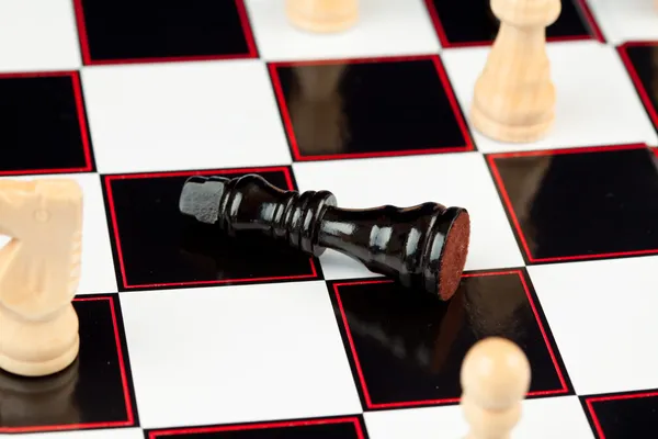 Black chessman lying — Stok fotoğraf