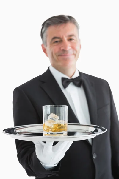 Man serving whiskey on toy — Stock Photo, Image