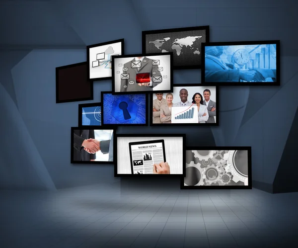 Molti schermi che mostrano immagini aziendali — Foto Stock