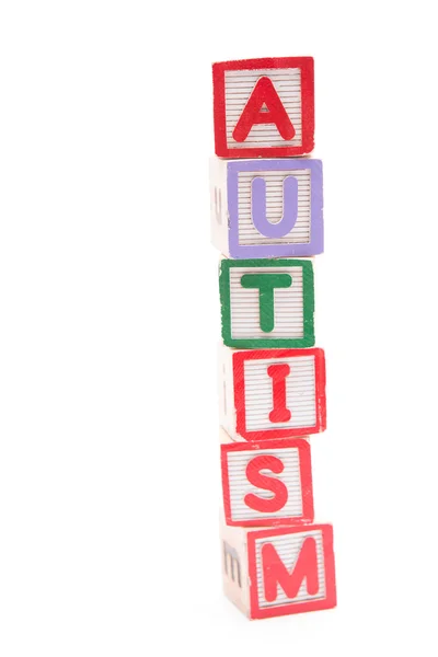 Autismo explicitado em blocos de letras empilhadas — Fotografia de Stock