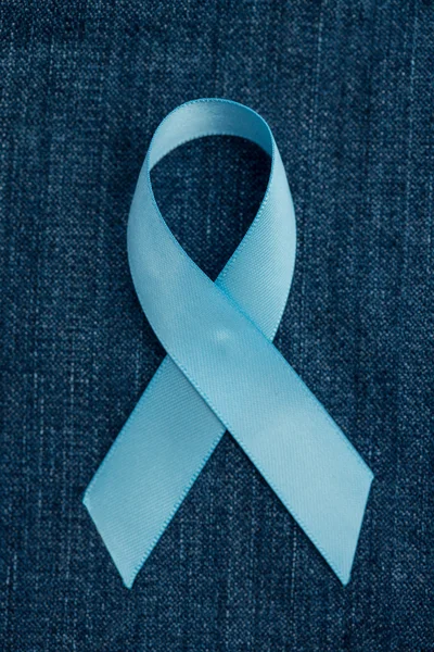 Blue ribbon for prostate cancer awareness on demin — Stock Photo, Image