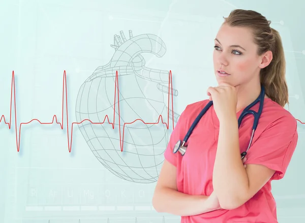 Portrait of a nurse thinking with a heart sketch — Stock Photo, Image