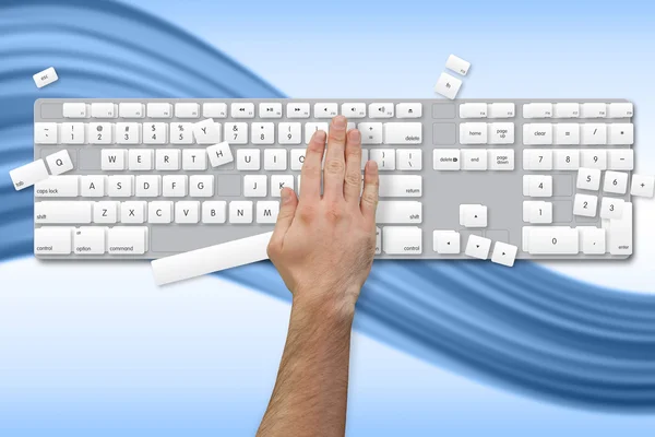 Hand breaking white and grey keyboard — Stock Photo, Image