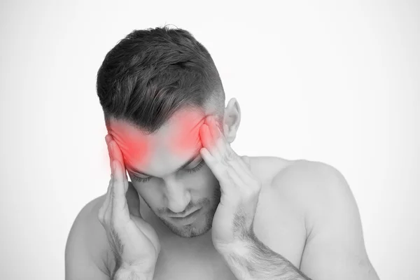 Man rubbing highlighted pain in temples — Stock Photo, Image