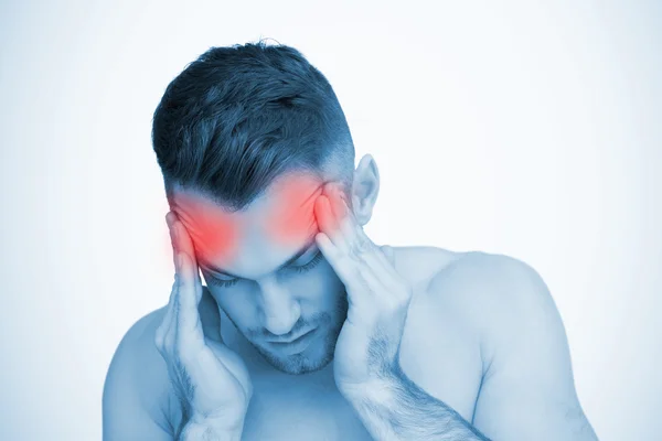 Man rubbing highlighted painful temples — Stock Photo, Image