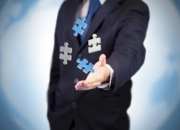 Businessman with digital puzzles levitating — Stock Photo, Image