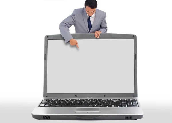 Zakenman naar beneden in lege laptop scherm — Stockfoto