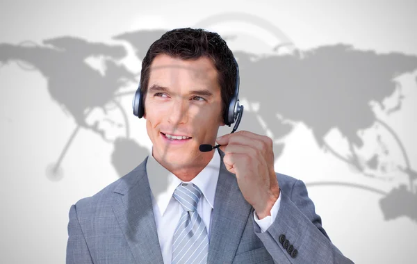 Smiling businessman using headset — Stock Photo, Image