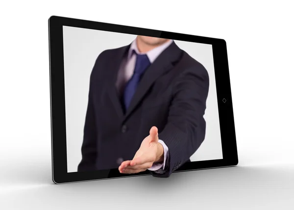 Businessman reaching out from tablet for handshake — Stock Photo, Image