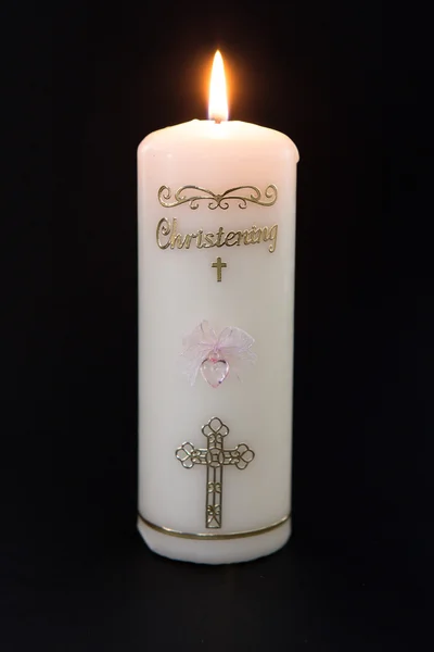 Zapalił chrzciny biała świeca z różowy szczegół — Zdjęcie stockowe