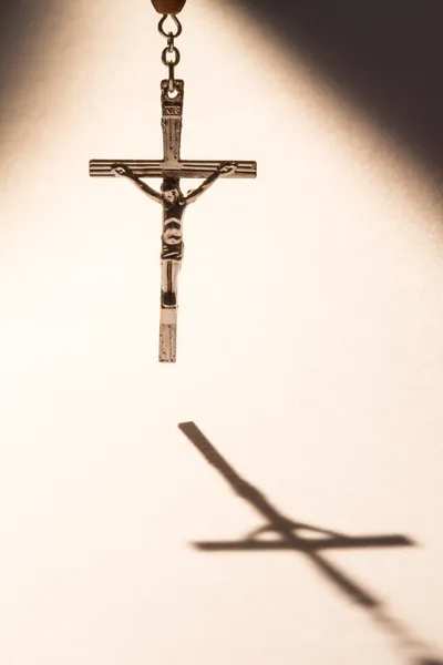 Cross casting a shadow — Stock Photo, Image