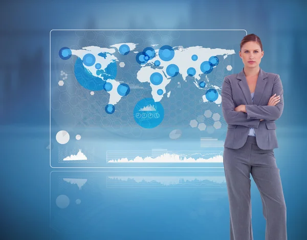 Businesswoman standing against a futuristic screen — Stock Photo, Image