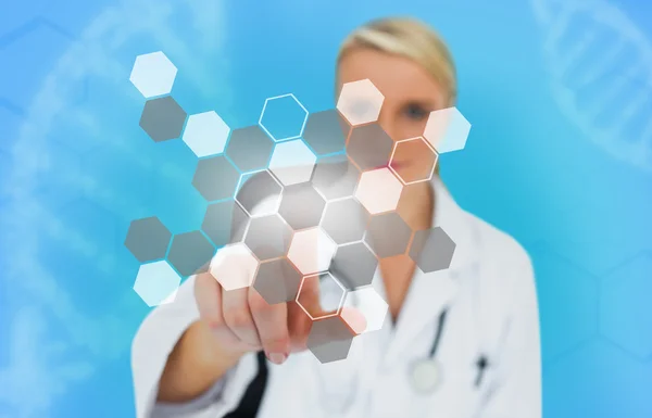 Blonde doctor pressing touchscreen displaying chemical formula — Stock Photo, Image