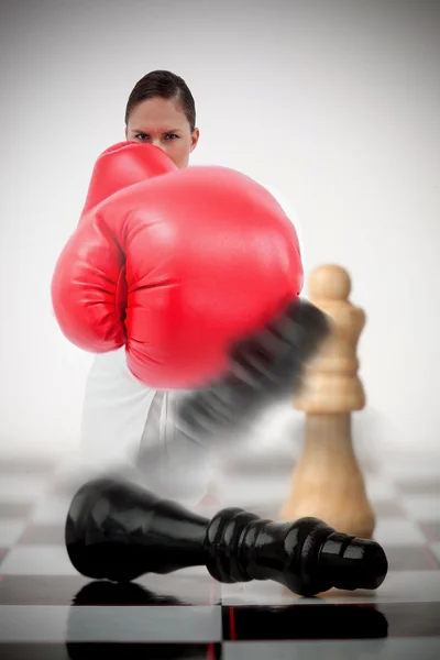 Black chess piece lying while white standing — Stock Photo, Image