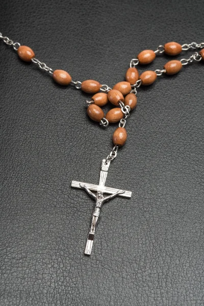 Rosary beads on a bible — Stock Photo, Image