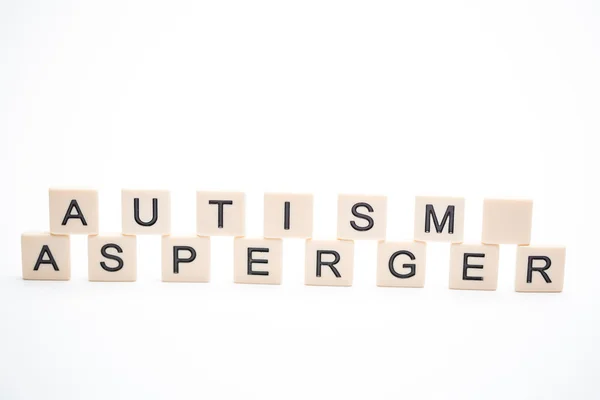 Autisme en asperger uiteengezet in kunststof brief stukken — Stockfoto