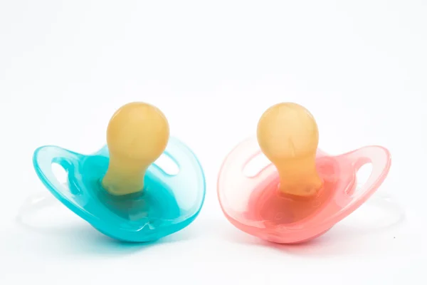 Blue and pink soothers — Stock Photo, Image