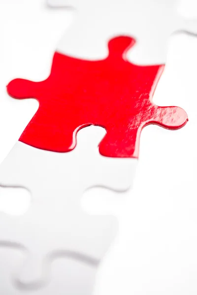 Red jigsaw piece — Stock Photo, Image