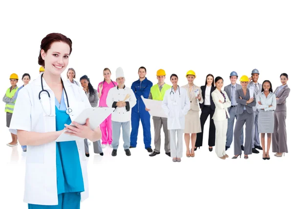 Pretty doctor standing in front of diverse career group — Stock Photo, Image