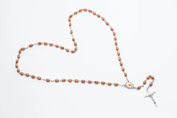 Rosary beads in a heart shape — Stock Photo, Image