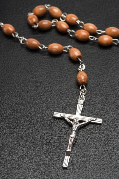 Rosary beads resting on a bible — Stock Photo, Image