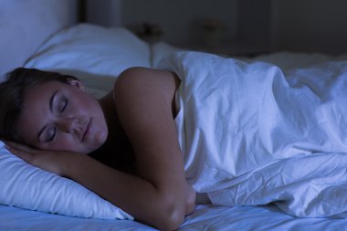 Woman sleeping at night clipart