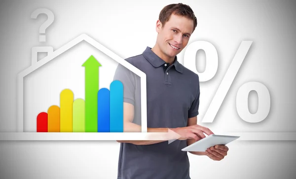 Man standing behind the energy efficient house graphic — Stock Photo, Image