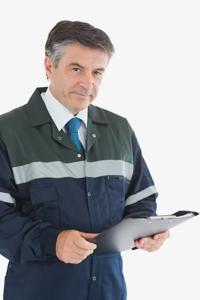 Mature repairman holding clipboard — Stock Photo, Image