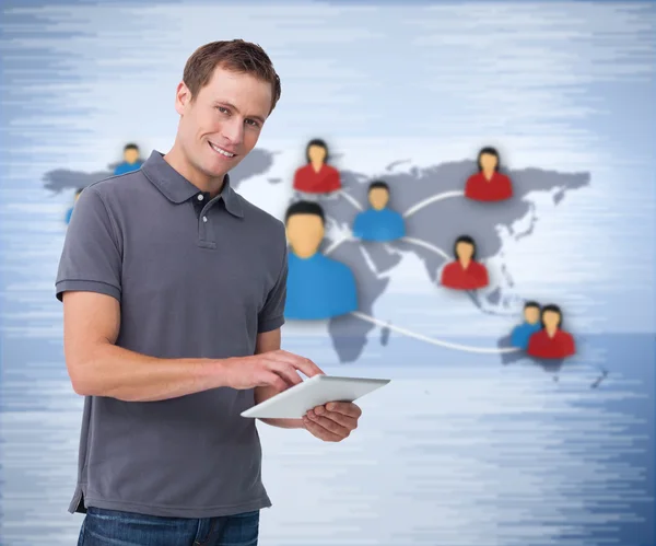 Smiling man holding a tablet — Stock Photo, Image