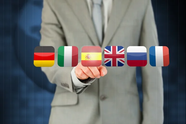 Businessman's finger activating state flags on touchscreen — Stock Photo, Image