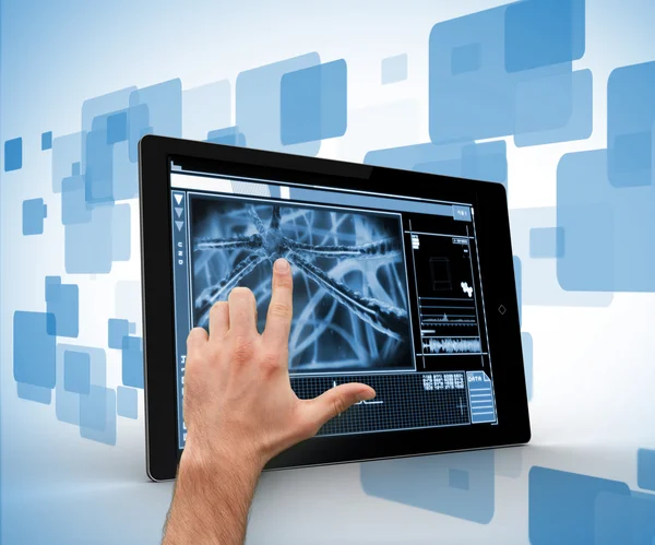 Hand touching a digital tablet on a digitally generated backgrou — Stock Photo, Image