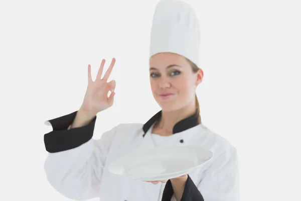 Chef with an empty plate gesturing ok sign — Stock Photo, Image