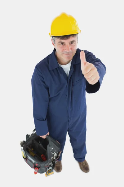 Technicien avec sac à outils geste pouces vers le haut — Photo
