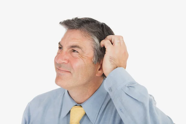 Businessman scratching head — Stock Photo, Image