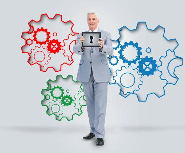 Mature business man presenting tablet — Stock Photo, Image
